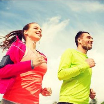 A woman and a man are jogging